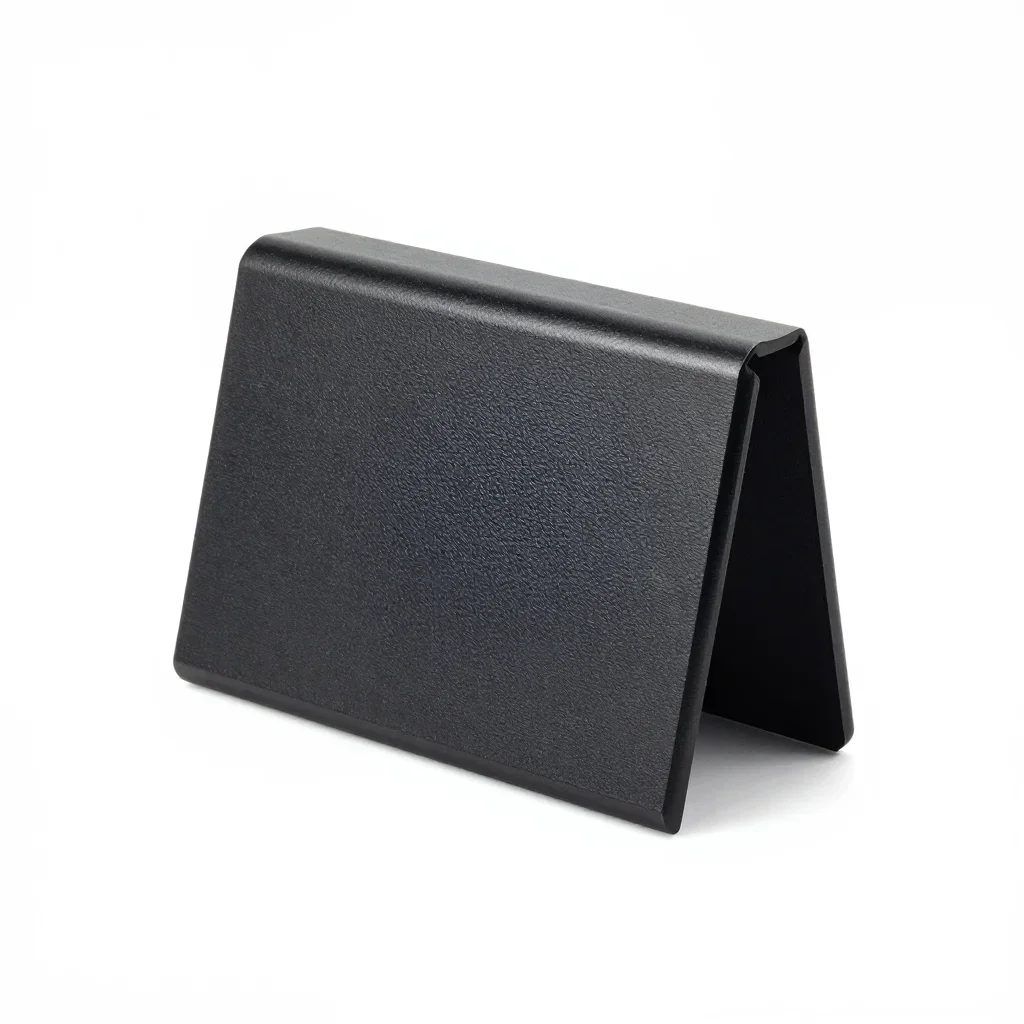 Matte black cable organiser isolated on a white background