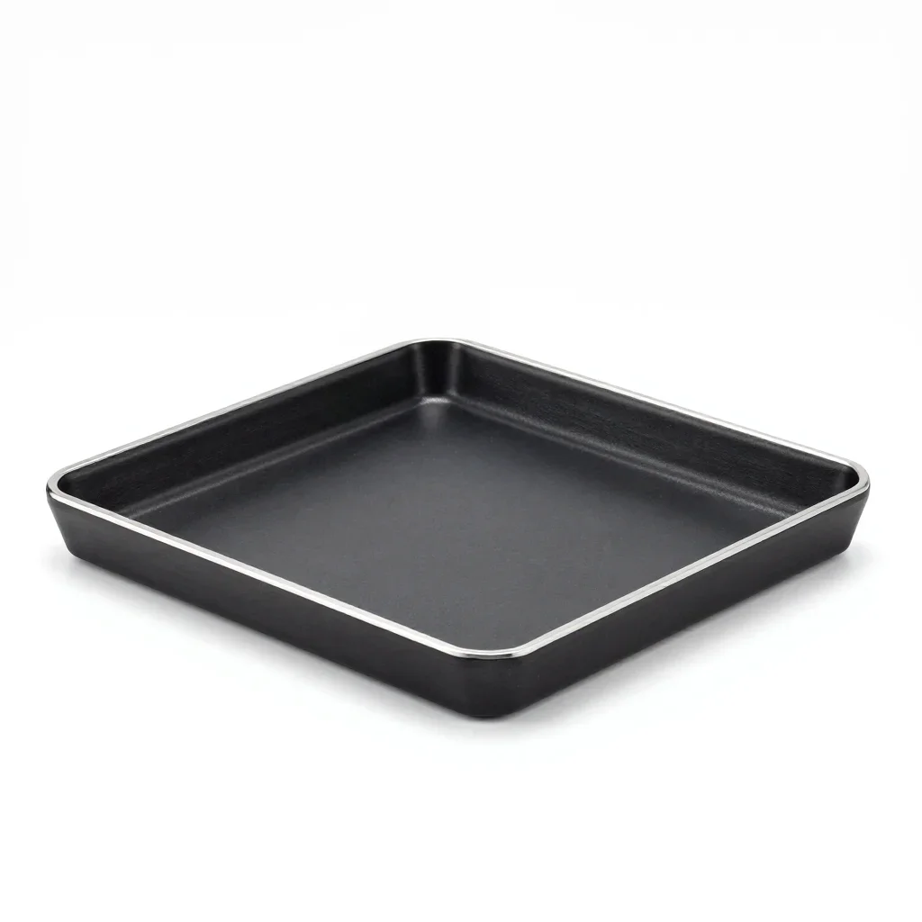 Matte black trivet isolated on a white background