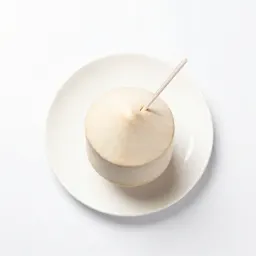 Fresh coconut with a straw