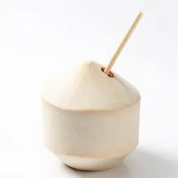 Fresh coconut with a straw