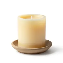 Beeswax pillar candle on a holder