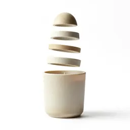 Scented candle in a vessel