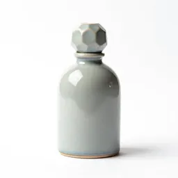 Perfume bottle with a faceted stopper