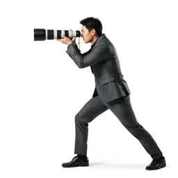 Wildlife photographer with a long lens