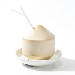 Fresh coconut with a straw