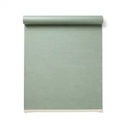 Hand-knotted wool rug rolled up