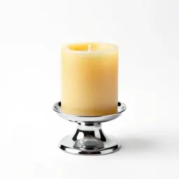 Beeswax pillar candle on a holder