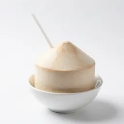 Fresh coconut with a straw