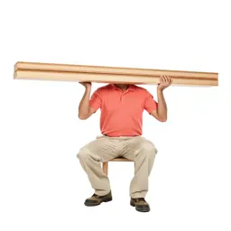 Carpenter shouldering timber