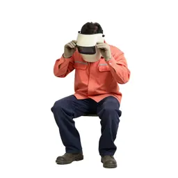Welder lifting a visor