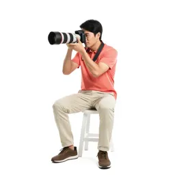 Wildlife photographer with a long lens