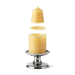 Beeswax pillar candle on a holder
