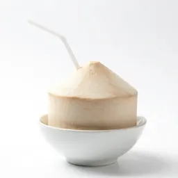 Fresh coconut with a straw