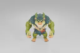 Muscular cartoon creature with green fur, leafy mane, and two curved horns