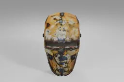 Rusty, weathered metal helmet with a narrow rectangular visor, scattered