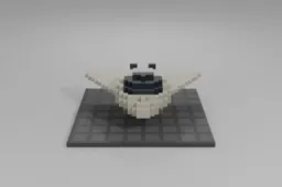 Compact, futuristic toy blaster with a white and orange color scheme