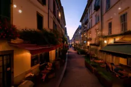 Narrow street in a European city at dusk