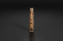 Photograph of a tall totem pole