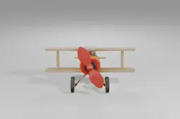 Toy biplane featuring a shiny yellow body, beige wings, large red spinning
