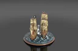 Two miniature pirate ships in combat on a resin ocean diorama base