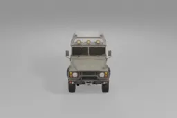 Rugged green military-style off-road vehicle stands on thick tires, equipped