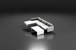 Large gray sectional sofa, white coffee table with books, vase of flowers