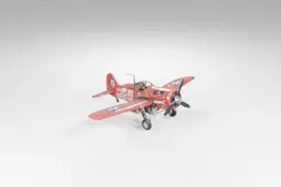 Small red biplane with a white stripe on the side