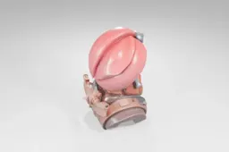 Small figurine of a pink helmet with a silver buckle on top