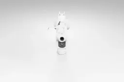 Black and white photograph of a small robot-like object