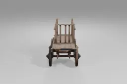 Wooden cart with four large spoked wheels and sturdy planks stands empty