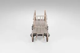 Small wooden cart with four wheels