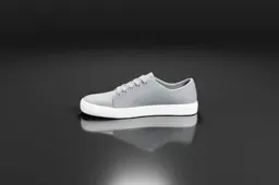 Photograph of a grey sneaker with a white sole