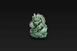 Photograph of a small, round, green-colored sculpture of a dragon