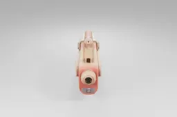Stylized toy blaster features a chunky red and beige body with playful