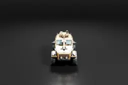 Photograph of a military vehicle, specifically a Humvee, on a black background