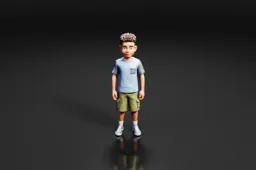 Young boy standing in a black background