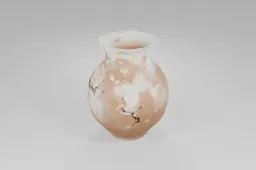 Brown ceramic jug with a single handle shows extensive surface cracks and