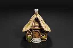 Miniature model of a small cottage with a thatched roof