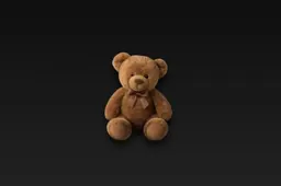 Teddy bear sitting on a black background