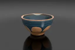 Hand-thrown ceramic ramen bowl with a deep blue drip glaze and rustic uneven