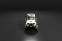 White off-road vehicle, specifically a Jeep Wrangler JK