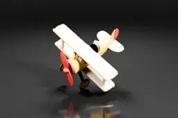 Yellow and beige toy biplane with red propeller and tail fin